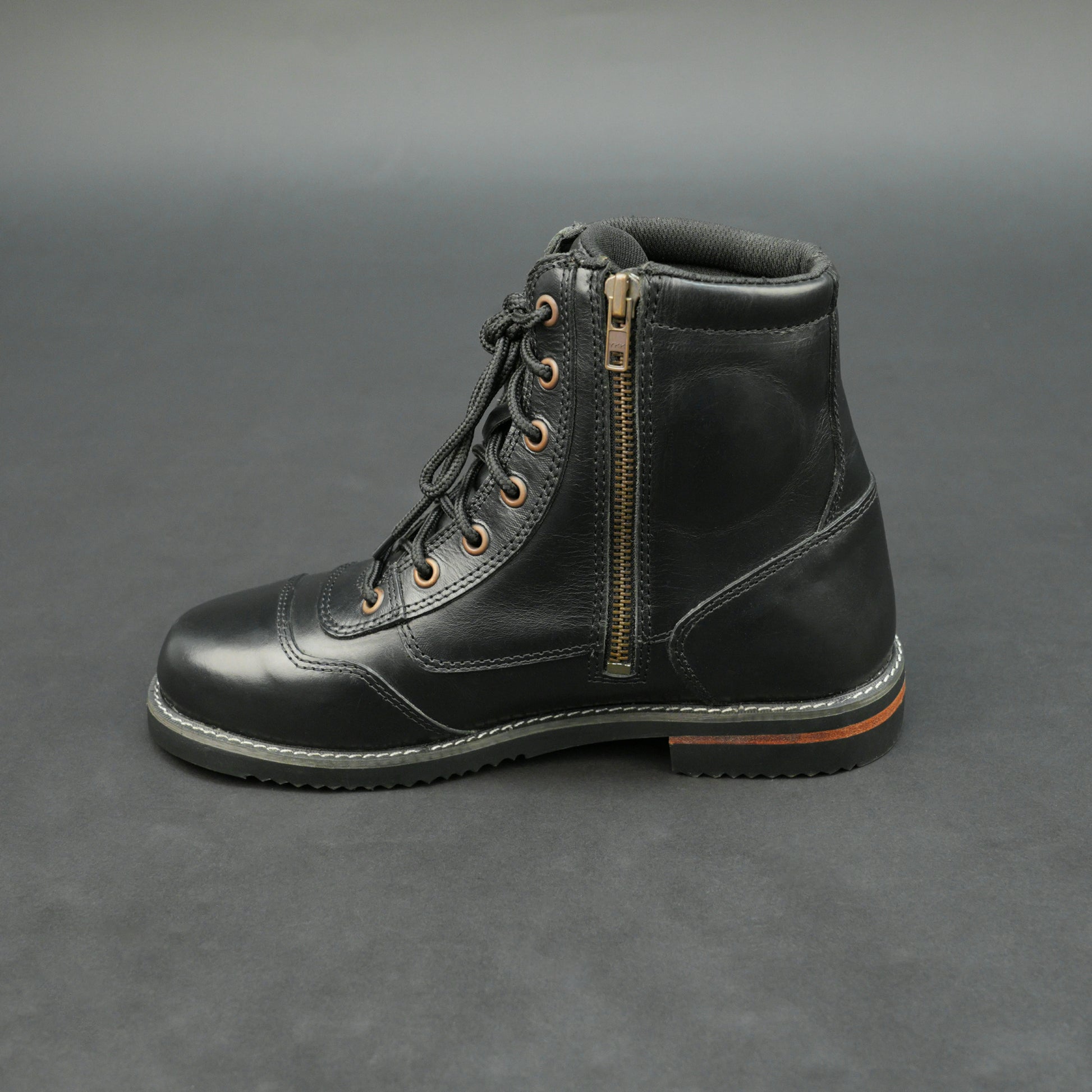 Black high-ankle bovine leather motorbike boots.