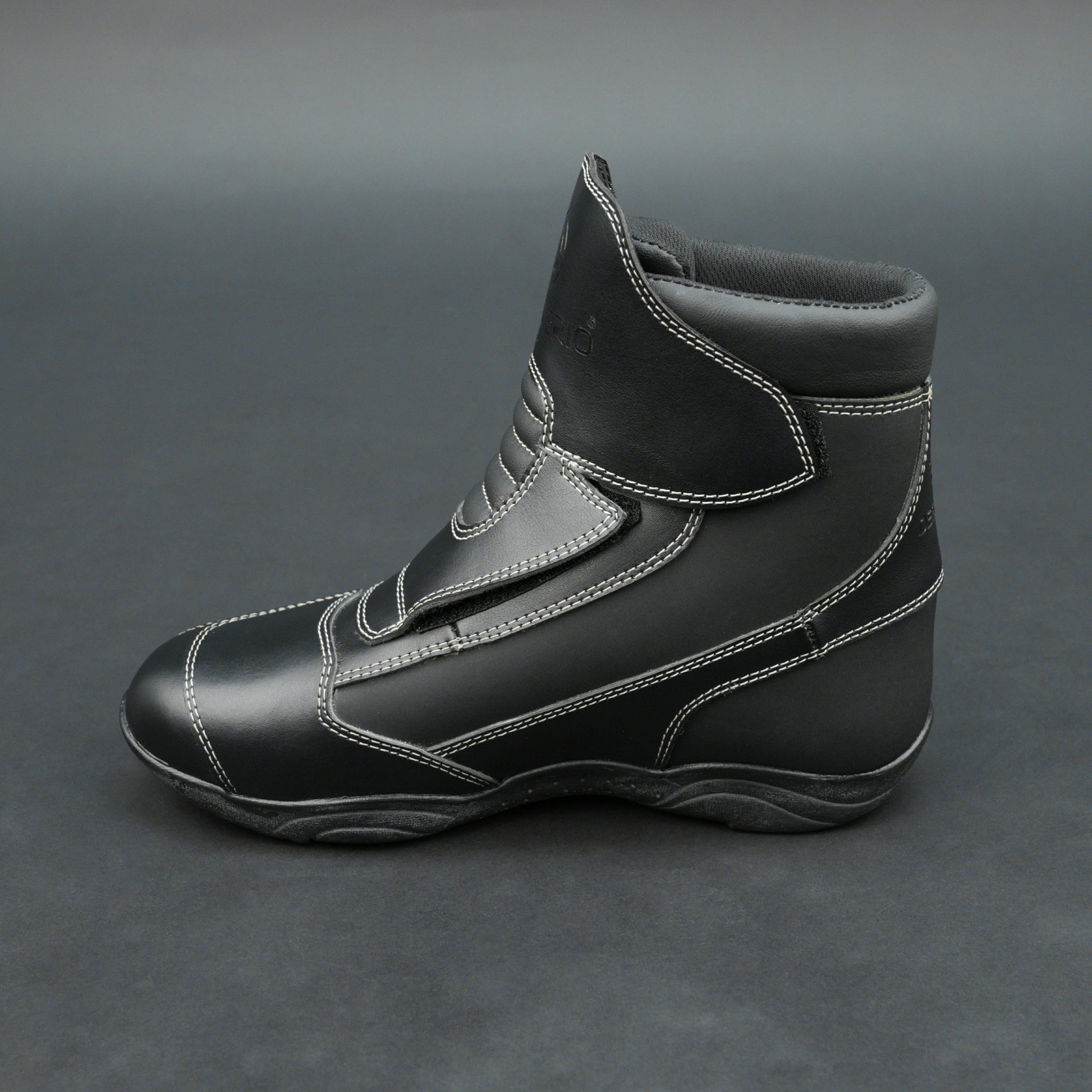 Premium black bovine leather biker boots with white stitching and Velcro straps.