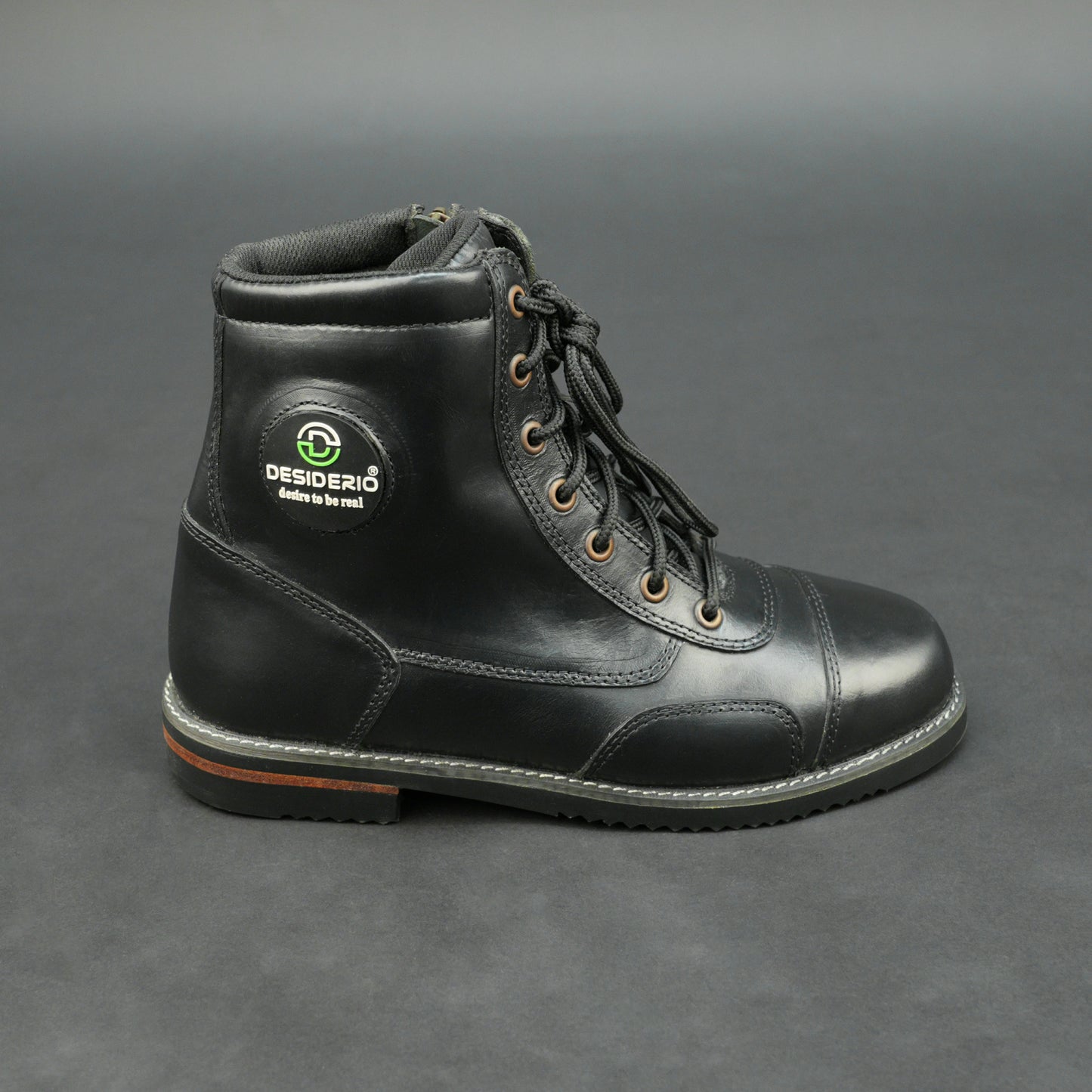 Black high-ankle bovine leather motorbike boots.