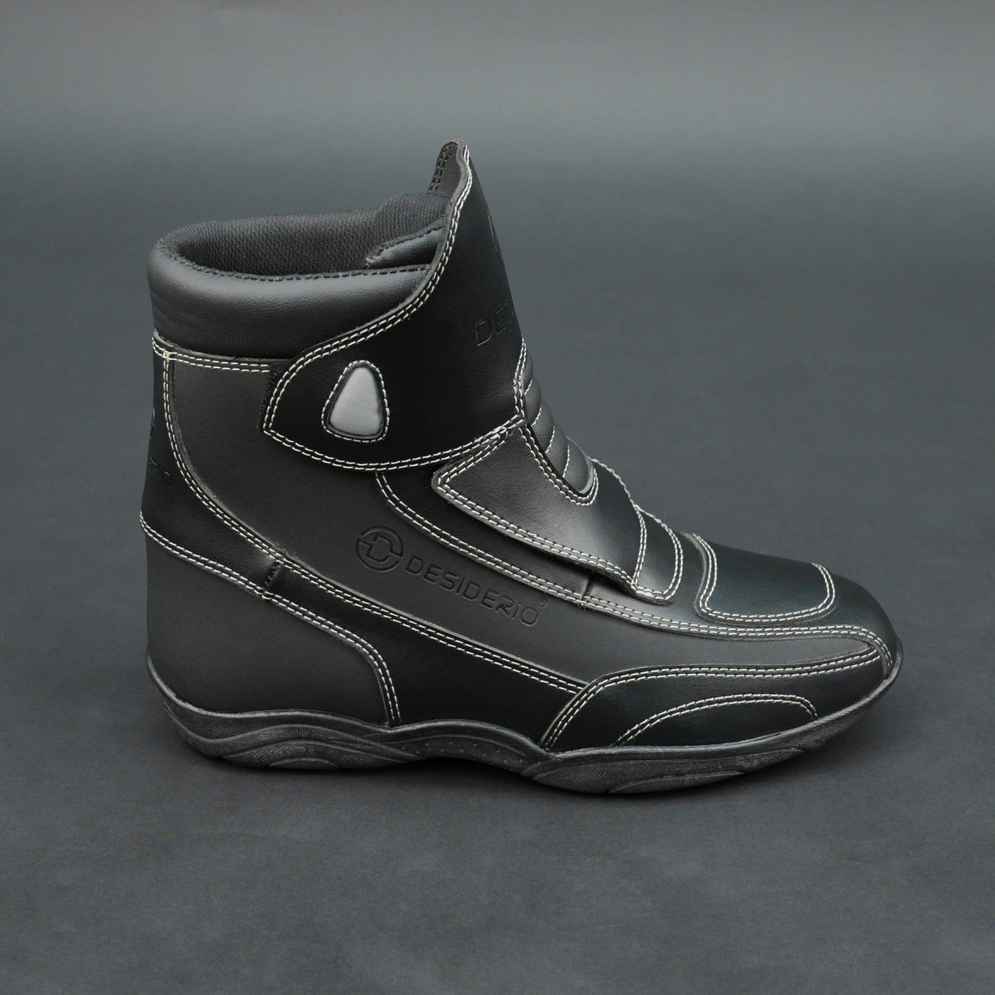 Premium black bovine leather biker boots with white stitching and Velcro straps.