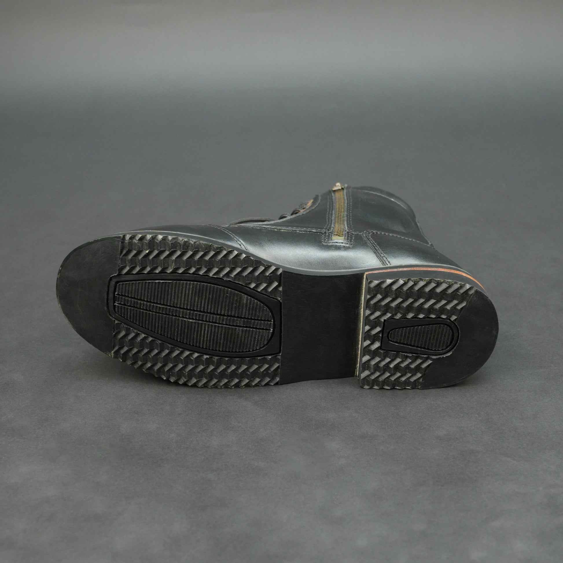 Black high-ankle bovine leather motorbike boots.