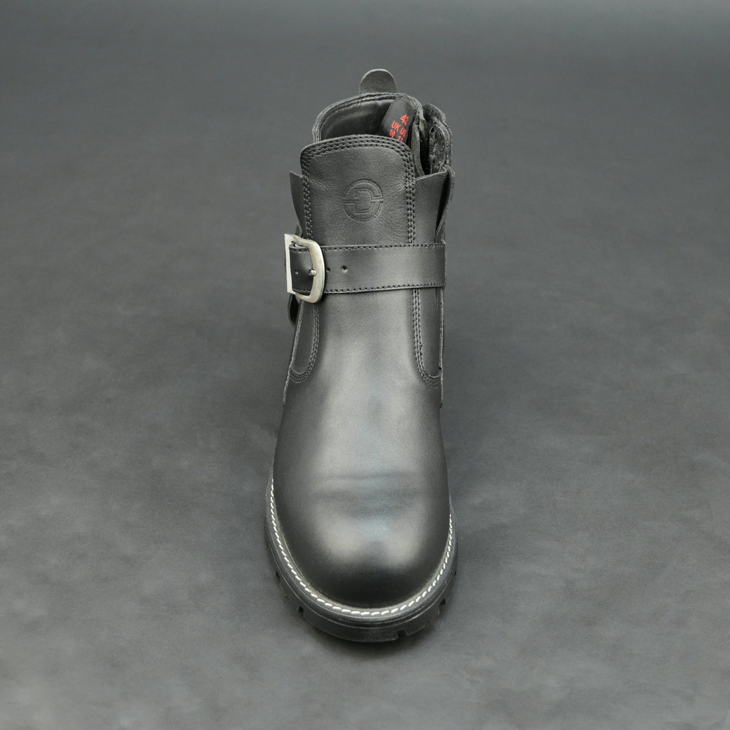 Matte black bovine leather biker boots with side buckle and zipper.