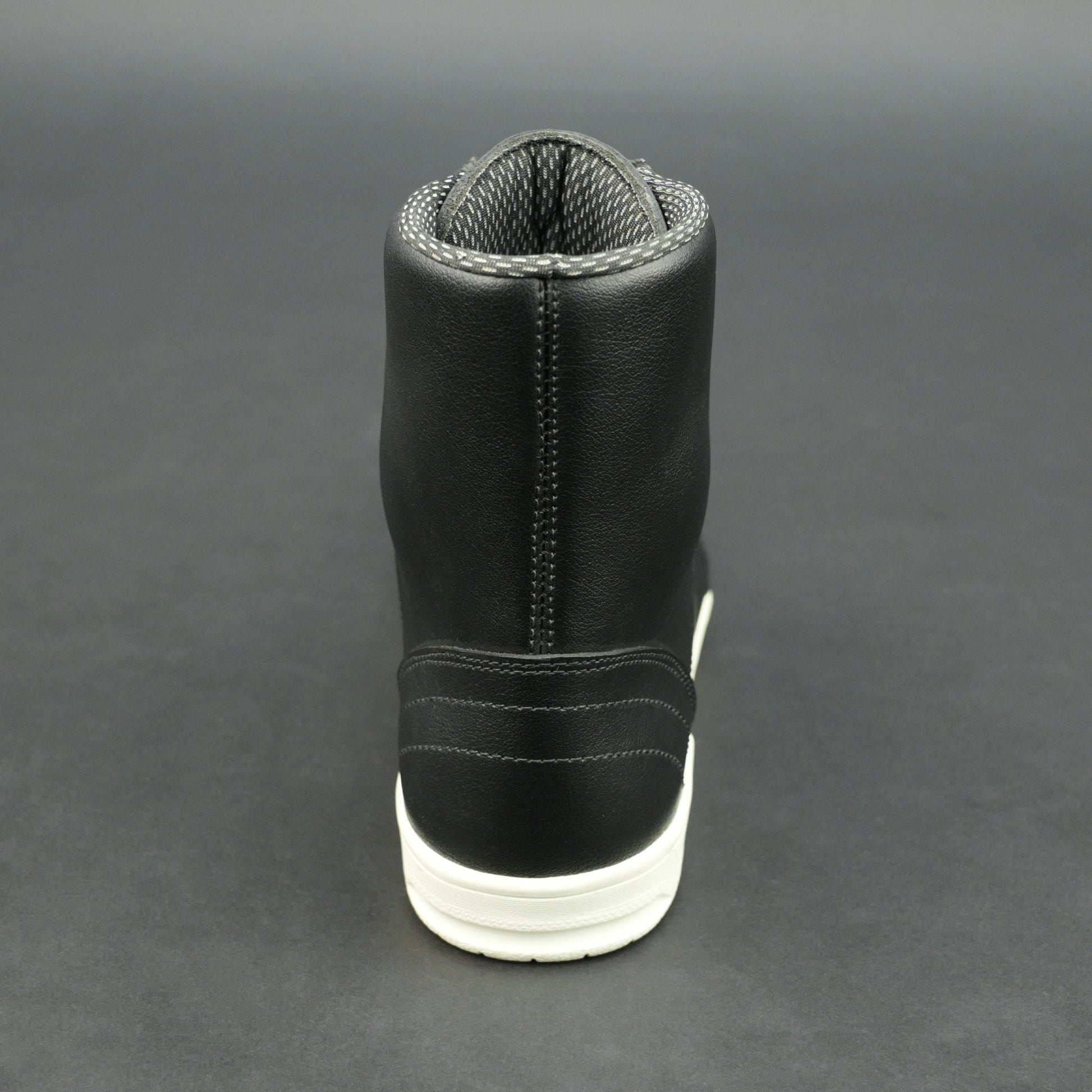 Black high-top leather sneakers with white sole.