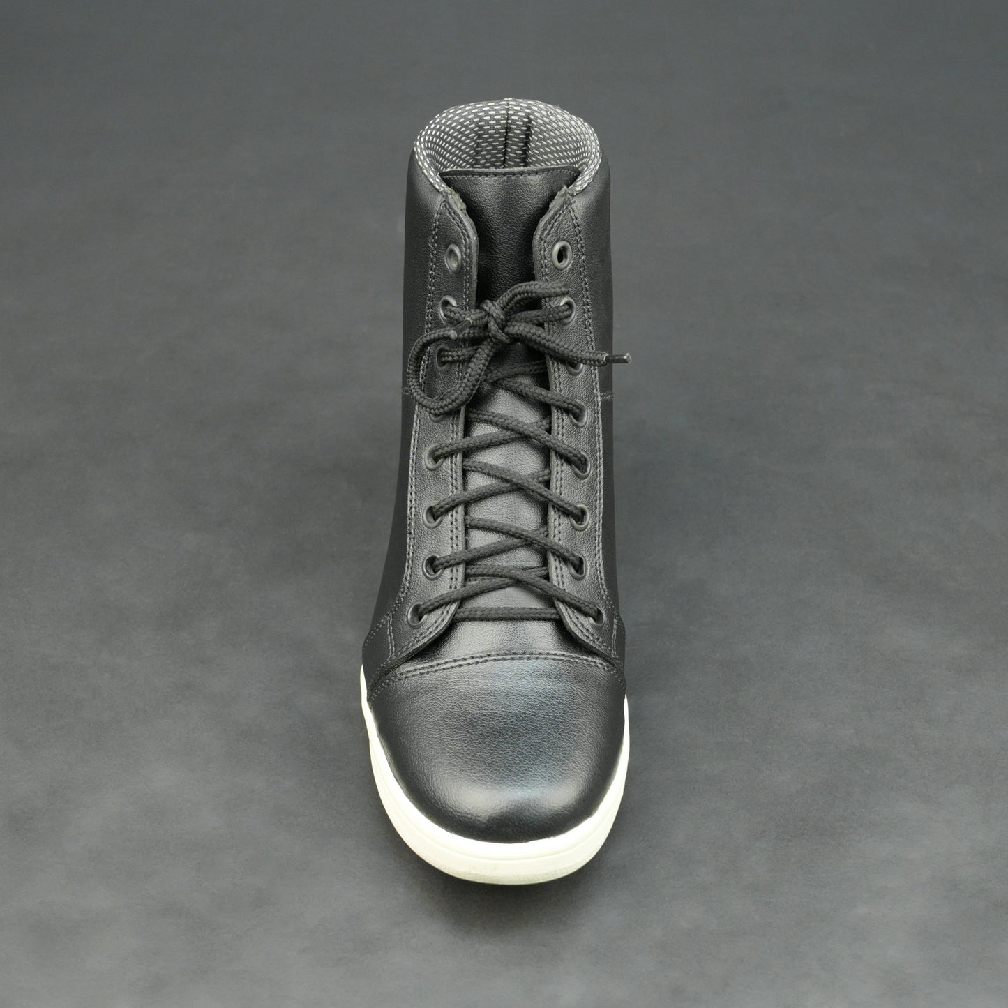 Black high-top leather sneakers with white sole.
