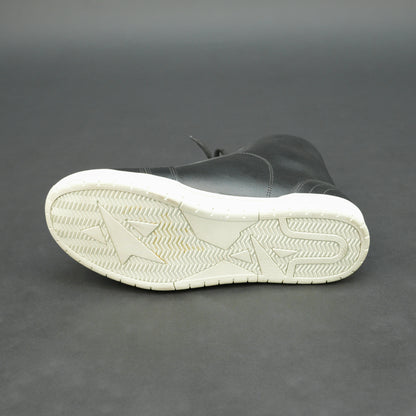 Black high-top leather sneakers with white sole.