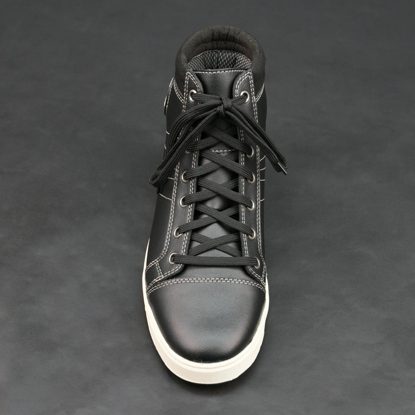 Black high-top bovine leather sneakers with white stitching and white sole.