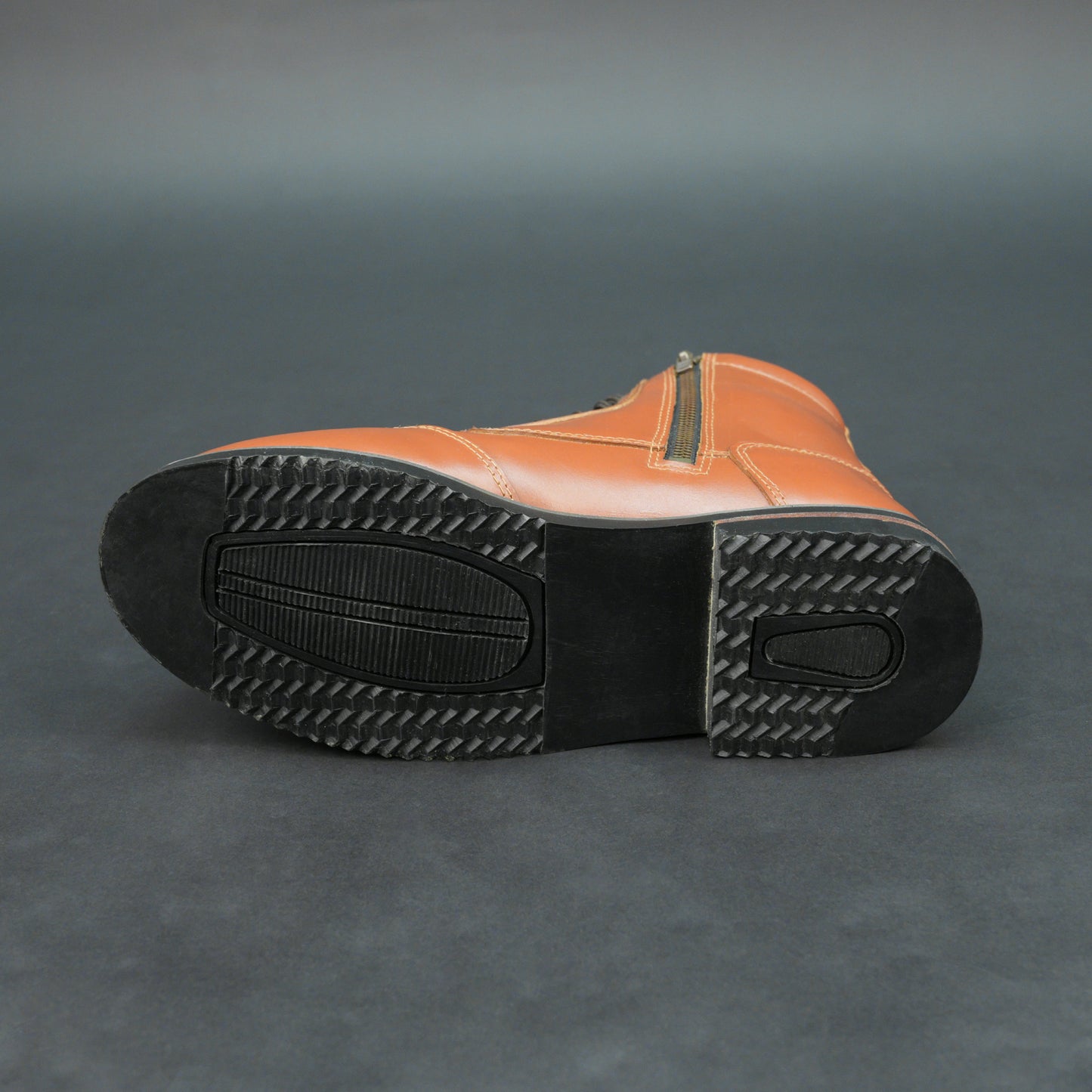 Brown bovine leather motorbike boots with side zipper and black laces.