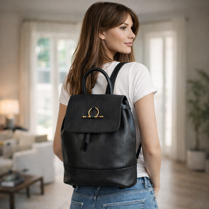 Black backpack with main compartment, inner zipper pocket, and comfortable shoulder straps for daily use