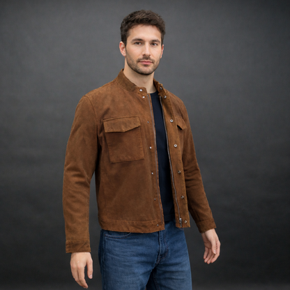 Men’s brown suede leather jacket with button-zip closure, front pocket, and modern fit, combining rugged durability with a refined silhouette