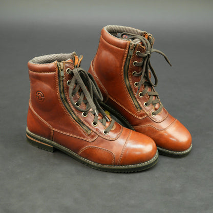 Cognac brown bovine leather motorbike boots with side zipper and lace-up design.