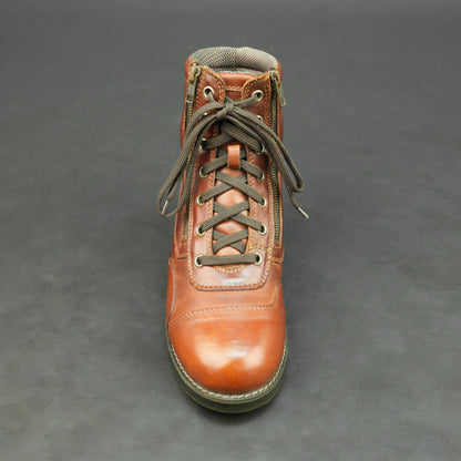 Cognac brown bovine leather motorbike boots with side zipper and lace-up design.