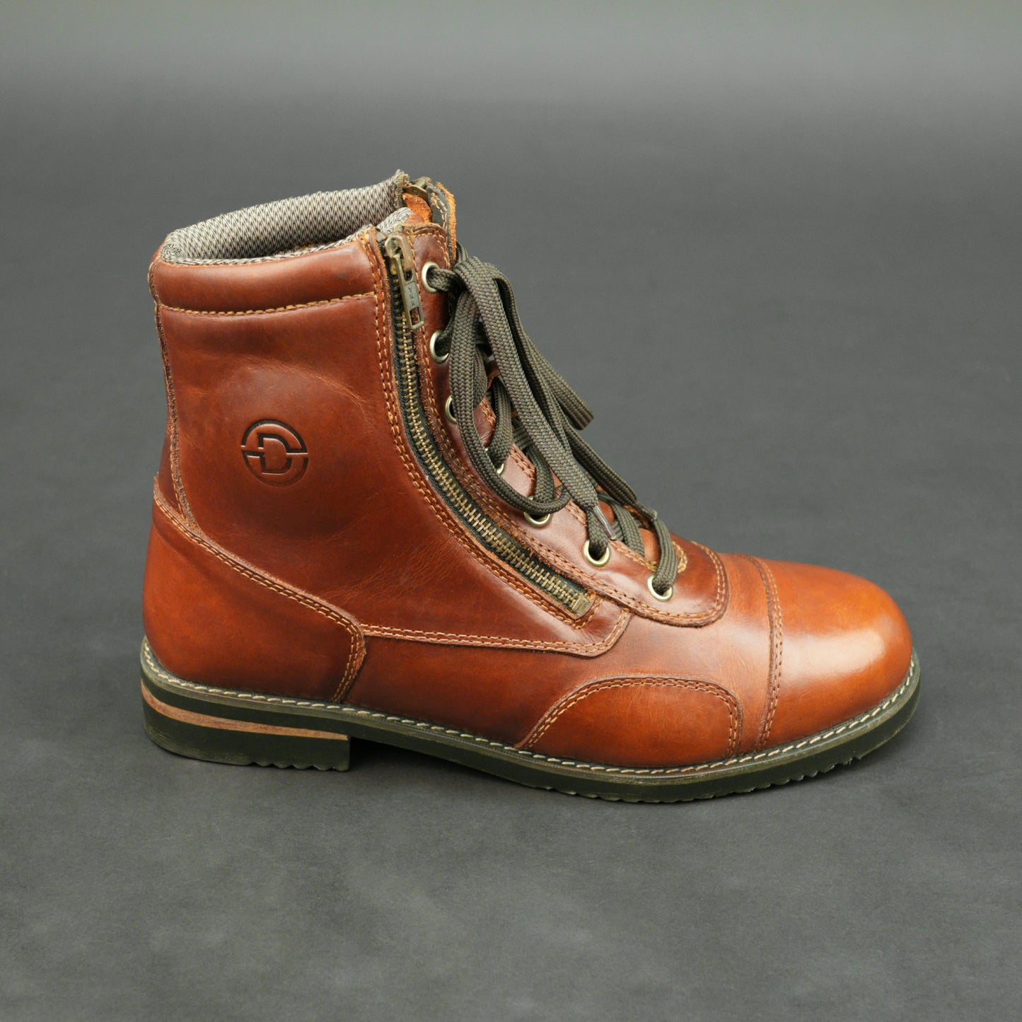 Cognac brown bovine leather motorbike boots with side zipper and lace-up design.