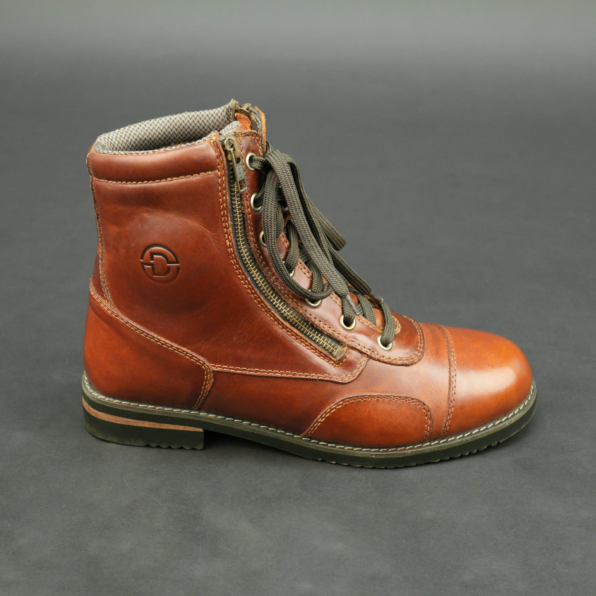 Cognac brown bovine leather motorbike boots with side zipper and lace-up design.