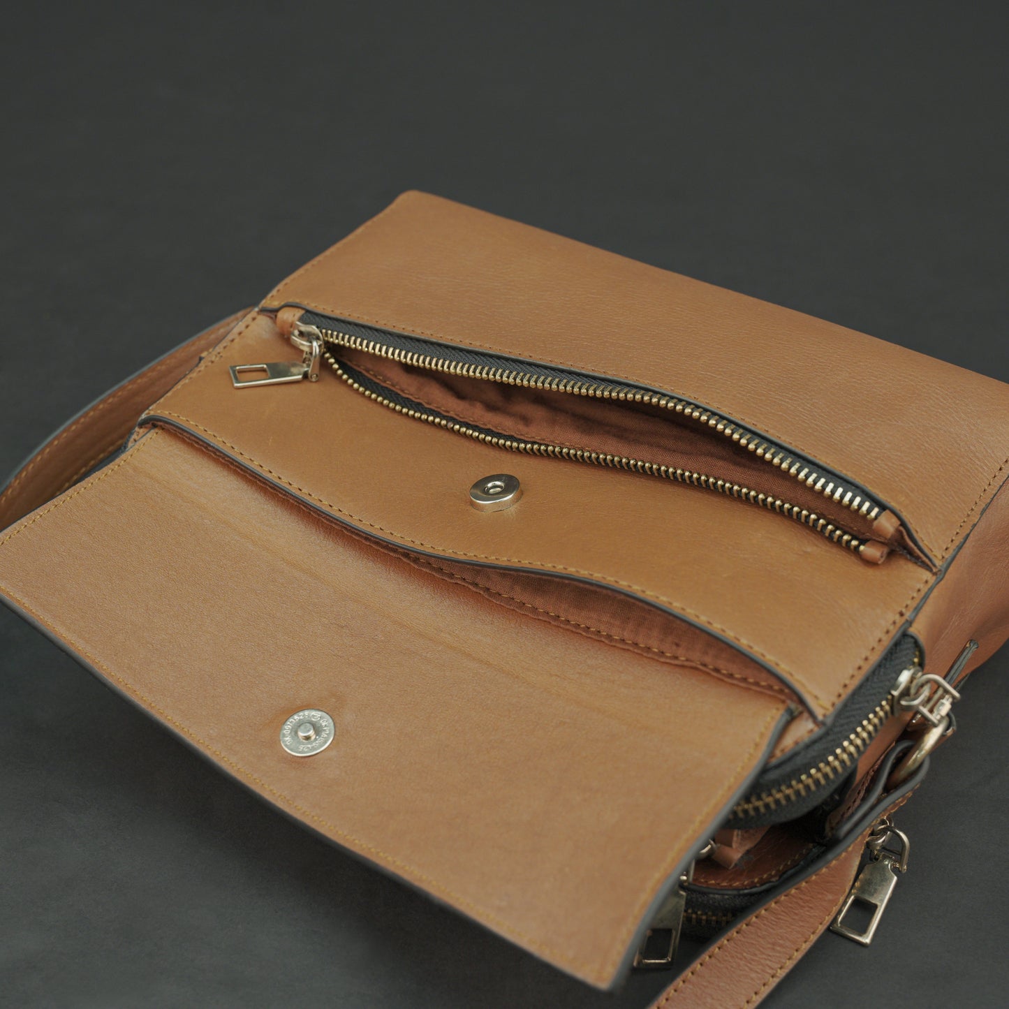 Nano Casetto Leather Crossbody Bag in 100% genuine cowhide leather with a compact, lightweight design, adjustable strap, and secure zip closure—perfect for daily wear, travel, and casual outings.