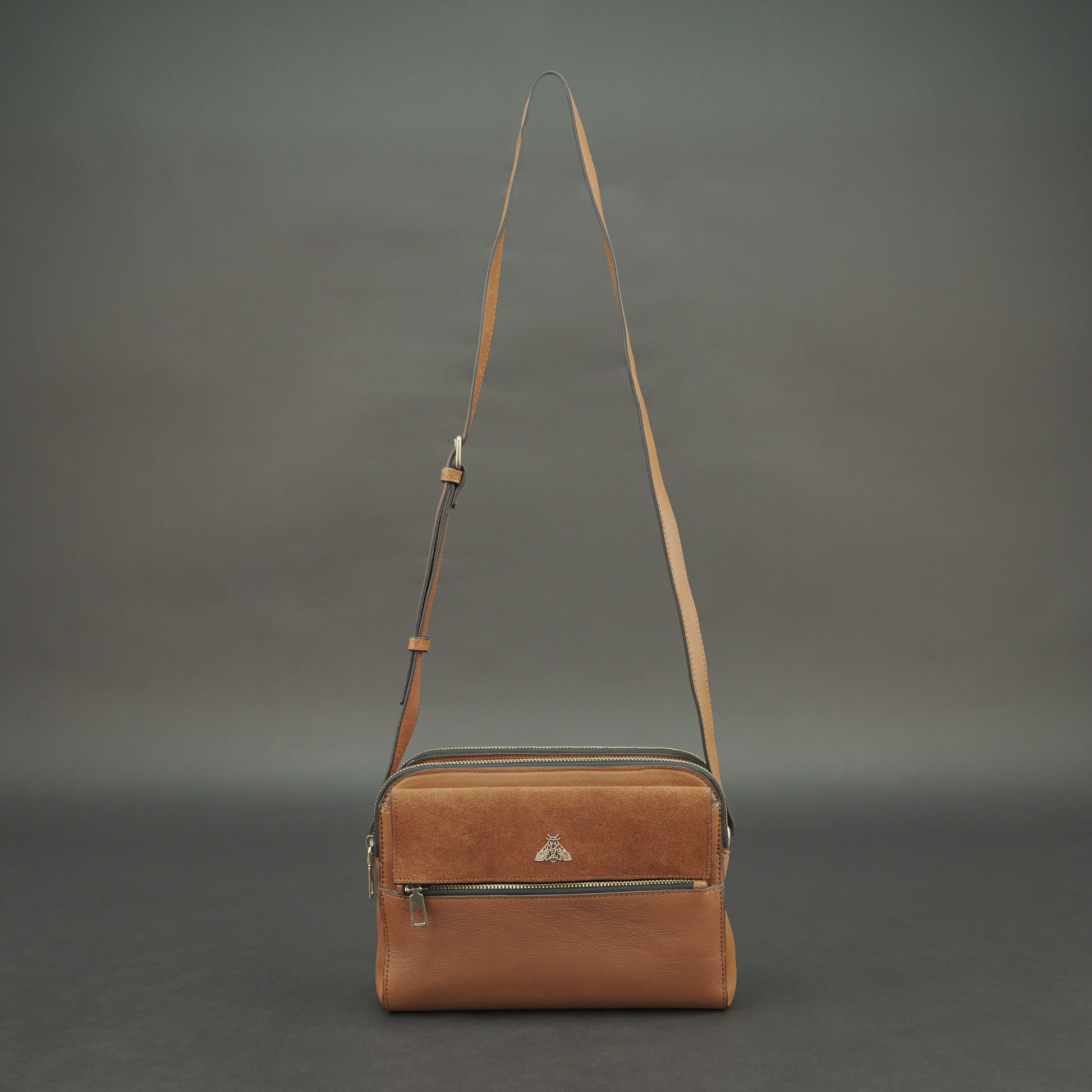 Nano Casetto Leather Crossbody Bag in 100% genuine cowhide leather with a compact, lightweight design, adjustable strap, and secure zip closure—perfect for daily wear, travel, and casual outings.