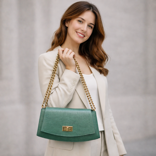 Real leather handbag with brass color chain, zipper compartment, shoulder and hand straps, available in multiple colors for daily use