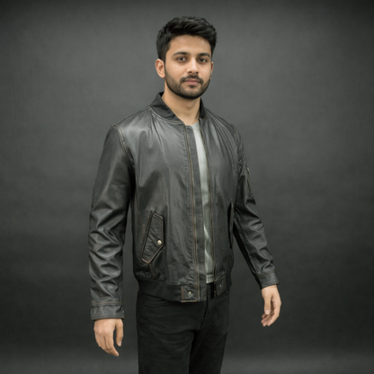 Black jacket with front zip closure, snap-button cuffs, one left arm pocket, two side pockets, and two inside pockets, combining stylish design with functional storage
