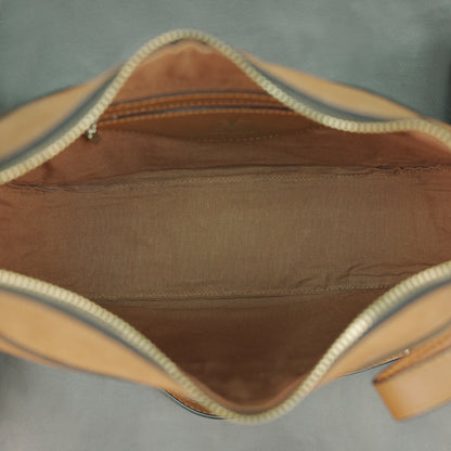 Leather Loop Bag in 100% genuine cowhide leather featuring an elegant loop handle, spacious interior, and durable stitching—perfect for work and everyday casual wear.