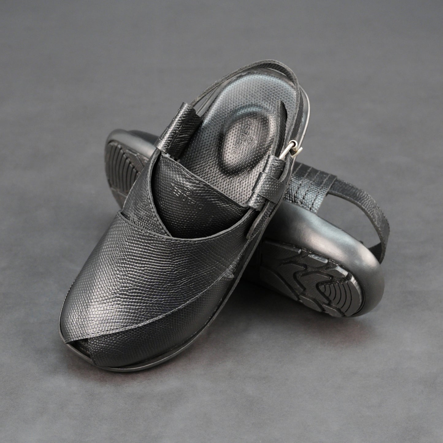 Black cow printed leather footwear with cushioned insole and TPR sole.