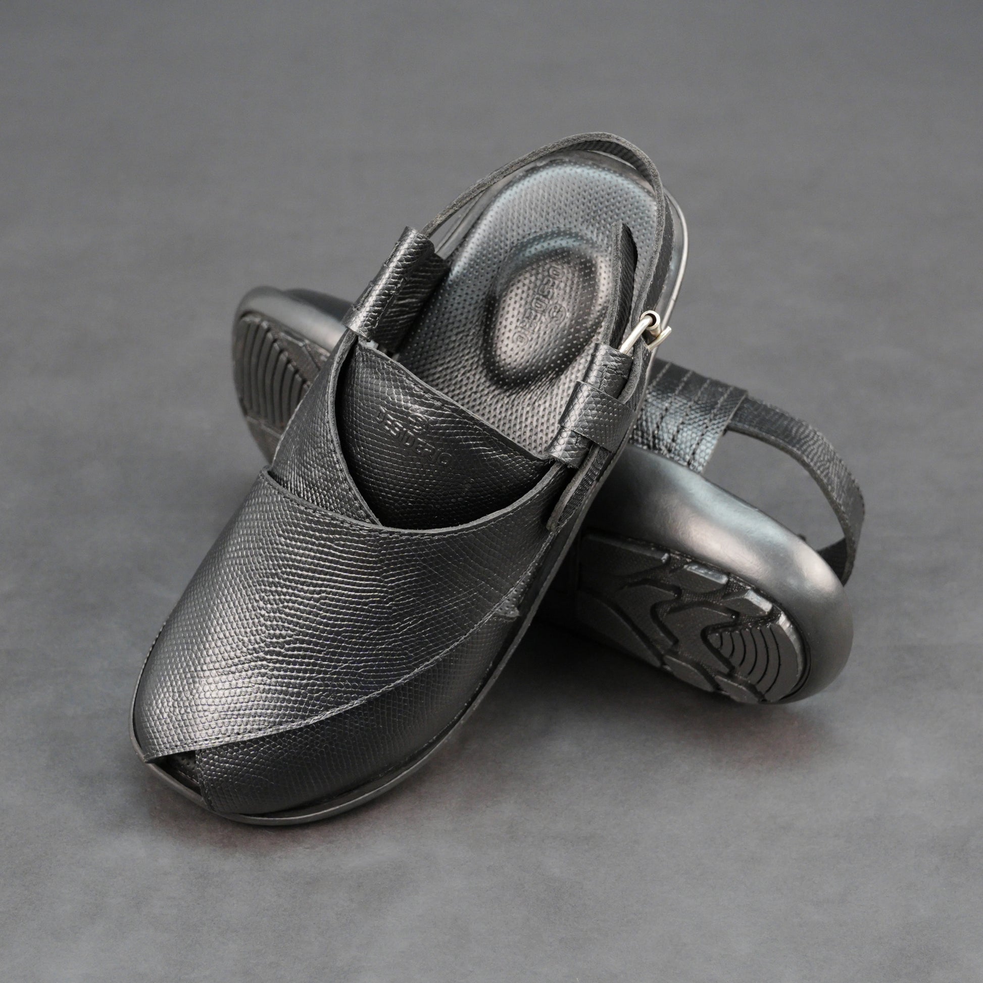 Black cow printed leather footwear with cushioned insole and TPR sole.