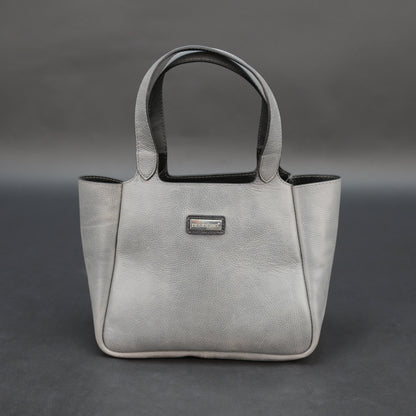 Premium grey cow vachetta leather bag with spacious compartment and inner pockets.