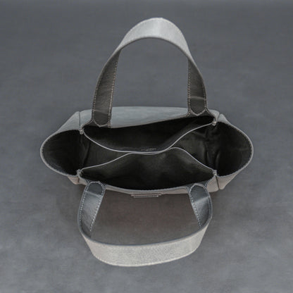 Premium grey cow vachetta leather bag with spacious compartment and inner pockets.