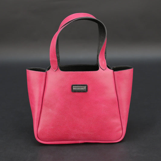 Pink cow vachetta leather bag with main compartment, inner pockets, and durable everyday design.