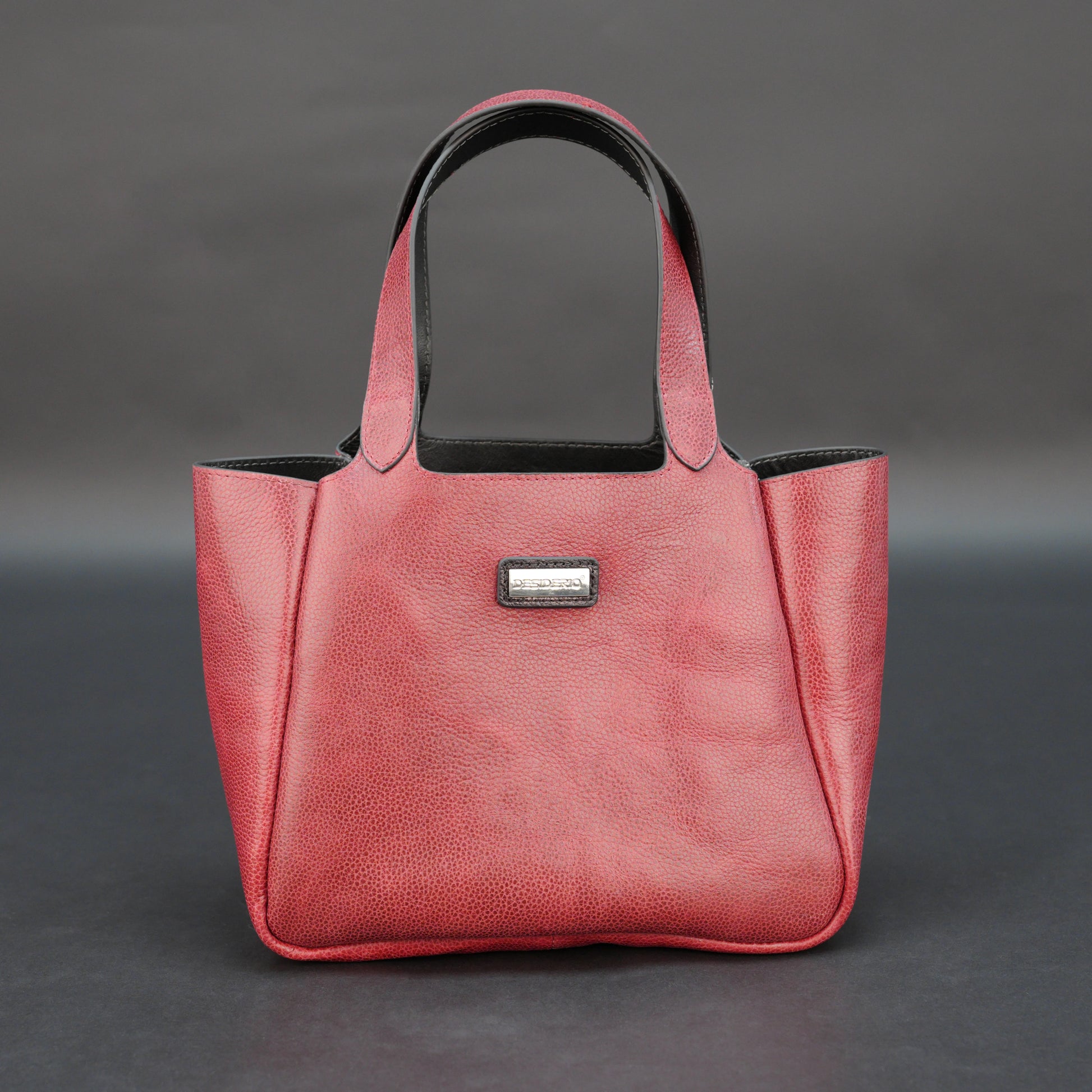 Premium red cow vachetta leather bag with spacious compartment and inner pockets.