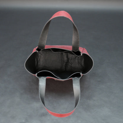 Premium red cow vachetta leather bag with spacious compartment and inner pockets.