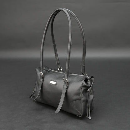 Black cow Chelsea leather bag with strap and pockets.
