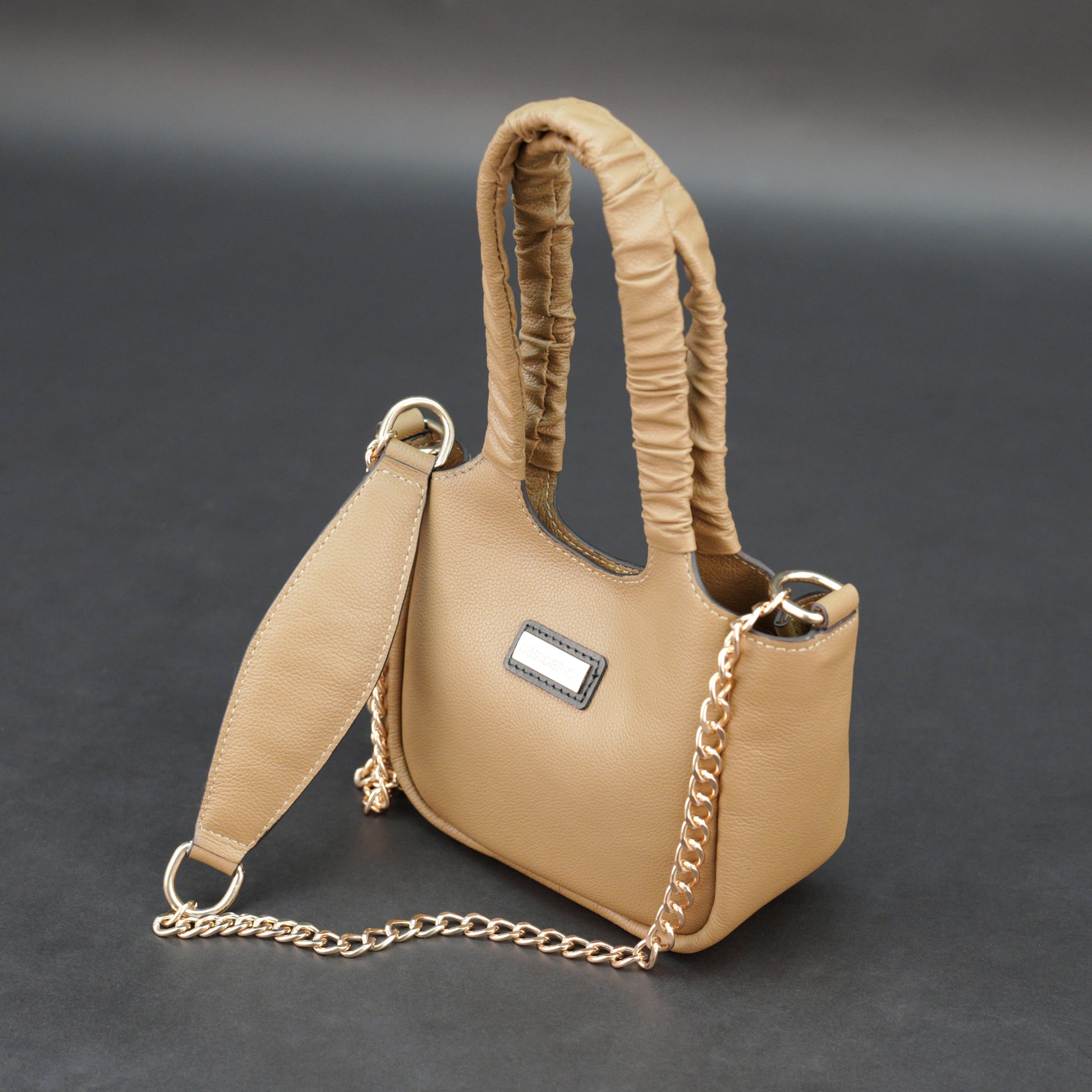 Beige cow Bamie leather bag with straps and pockets.