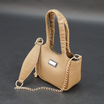 Beige cow Bamie leather bag with straps and pockets.