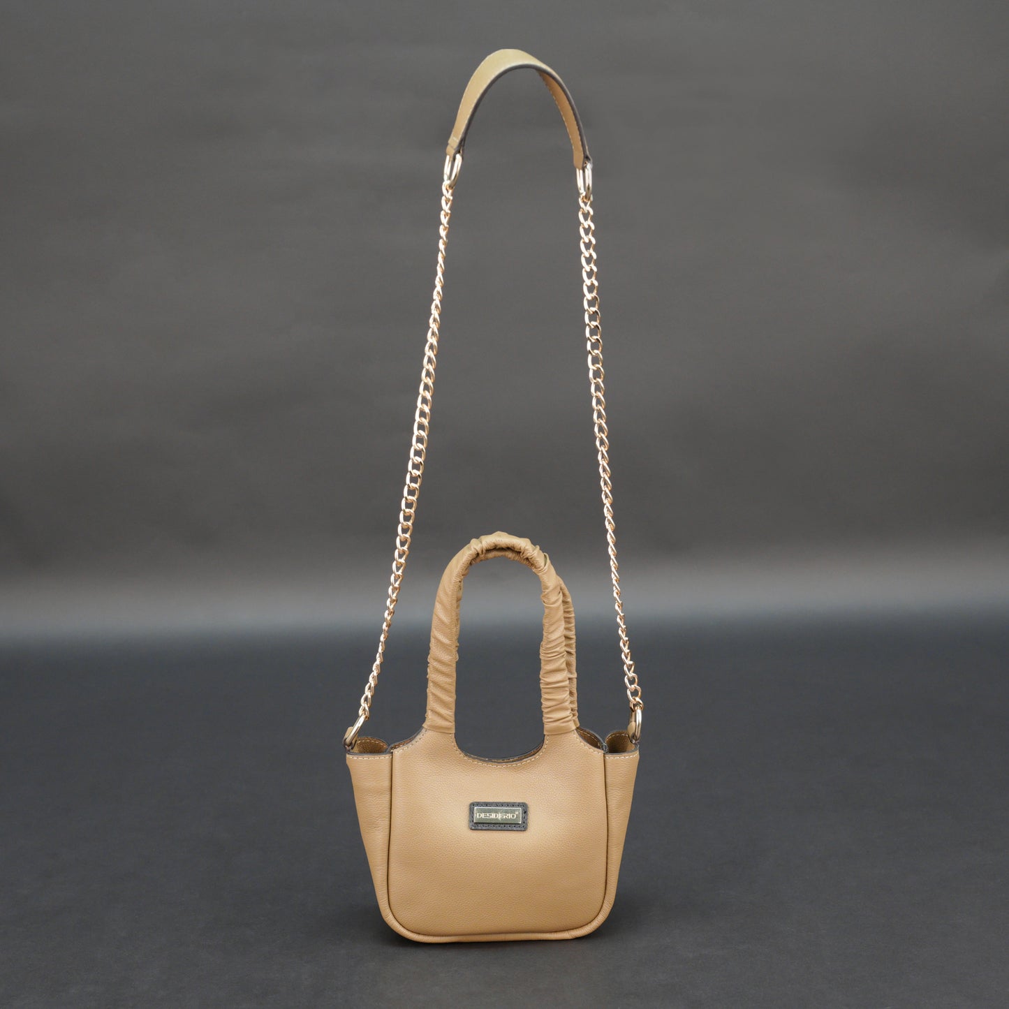 Beige cow Bamie leather bag with straps and pockets.