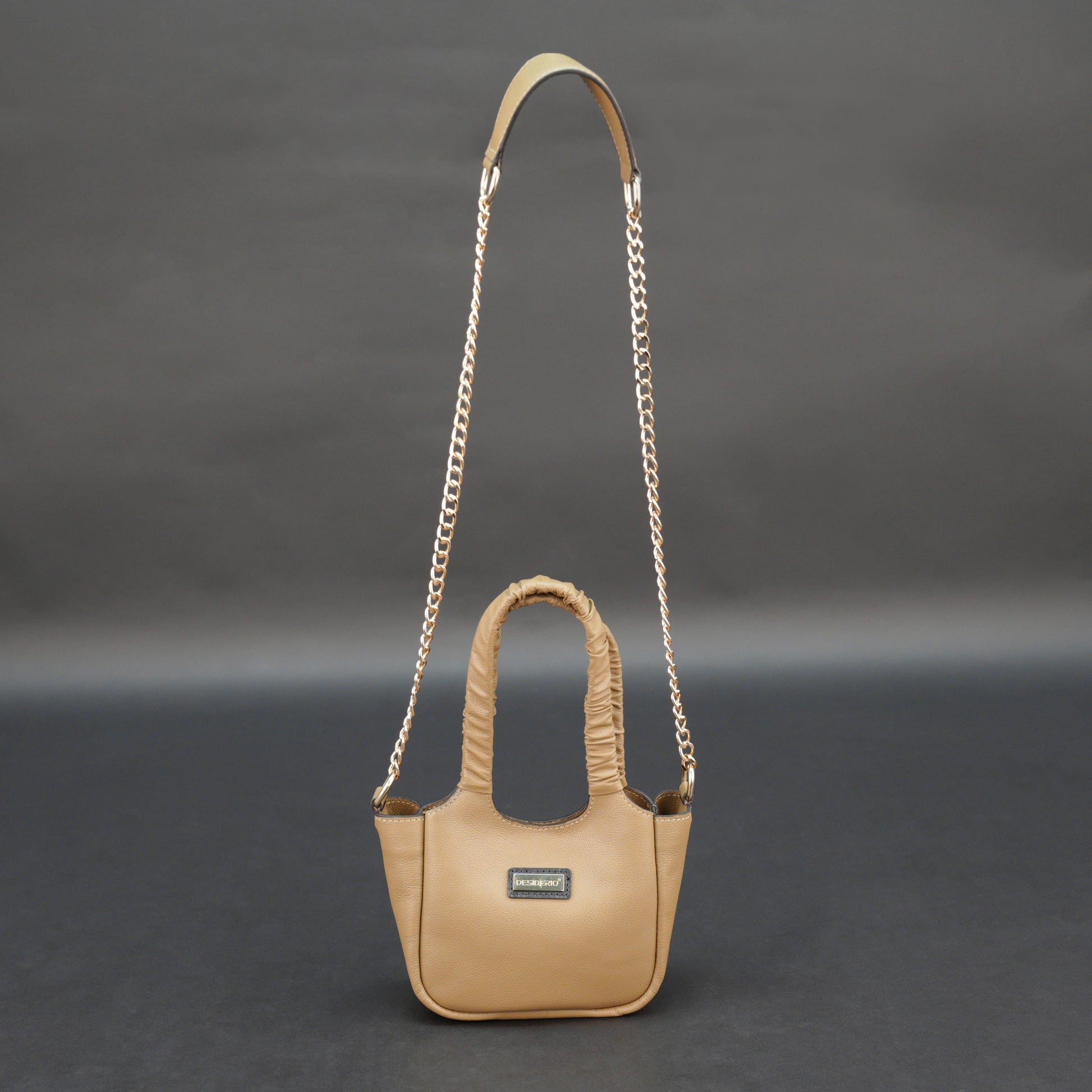 Beige cow Bamie leather bag with straps and pockets.