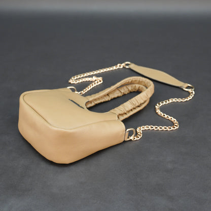 Beige cow Bamie leather bag with straps and pockets.