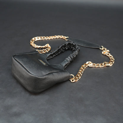Black sheep croco leather bag with straps and pockets.