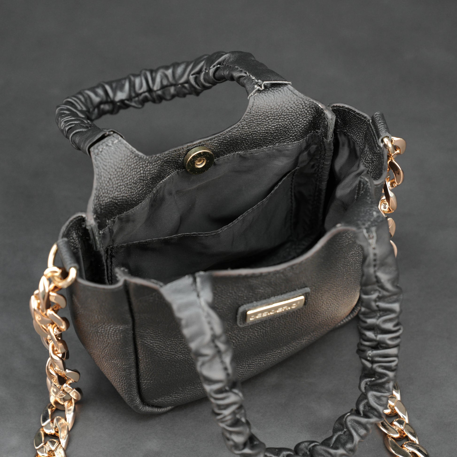 Black sheep croco leather bag with straps and pockets.