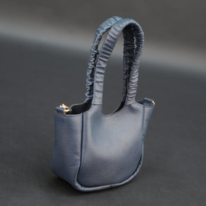 Deep blue premium cow leather bag with shoulder strap, main compartment, and inner pocket.