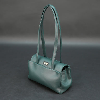 Deep jade cow Bamie leather bag with straps, dual compartments, and zipper pocket.