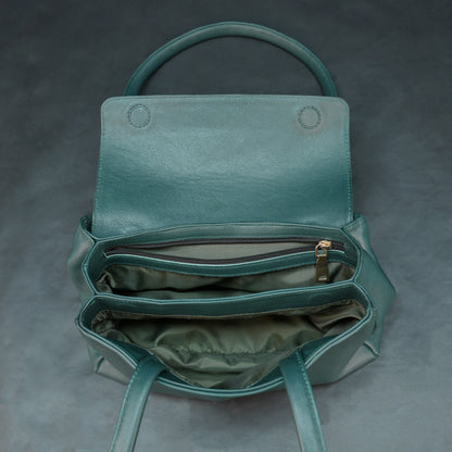 Deep jade cow Bamie leather bag with straps, dual compartments, and zipper pocket.
