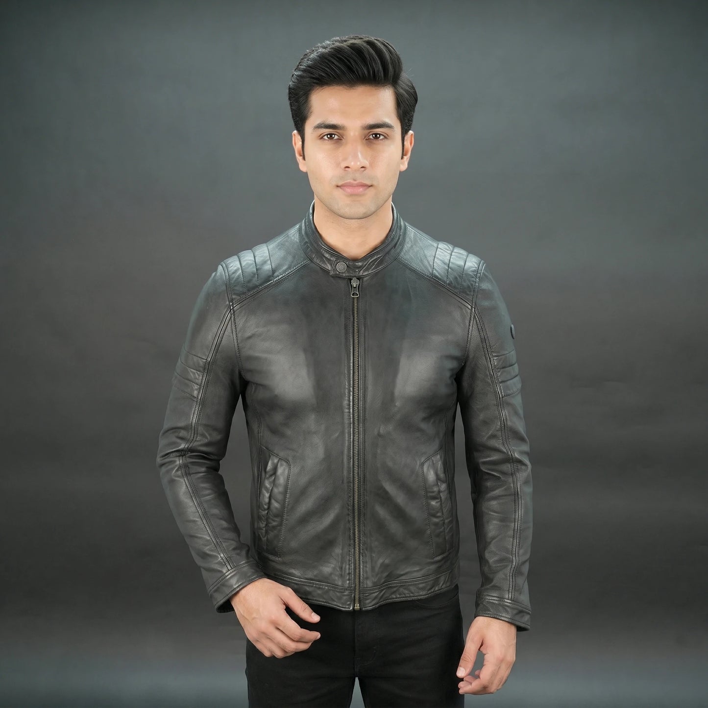 Black leather jacket with mandarin collar, quilted shoulders, and slim fit.