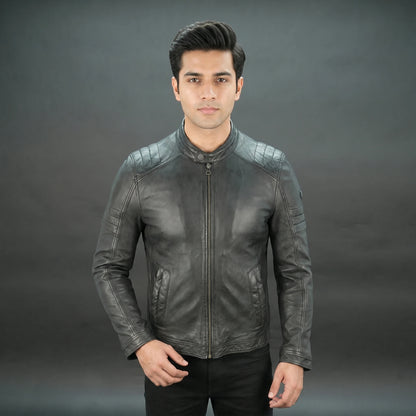 Black leather jacket with mandarin collar, quilted shoulders, and slim fit.