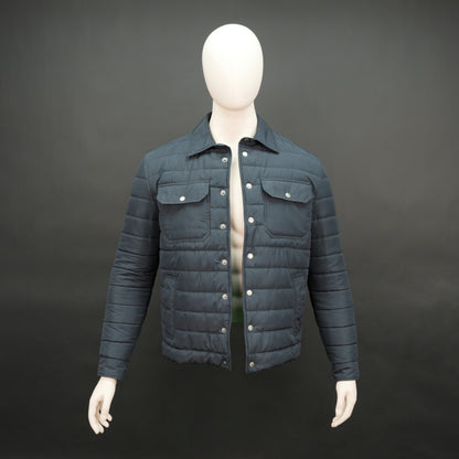 Men’s navy button-down quilted puffer jacket with six pockets, full sleeves, and snap closure.