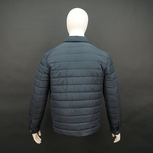 Men’s navy button-down quilted puffer jacket with six pockets, full sleeves, and snap closure.