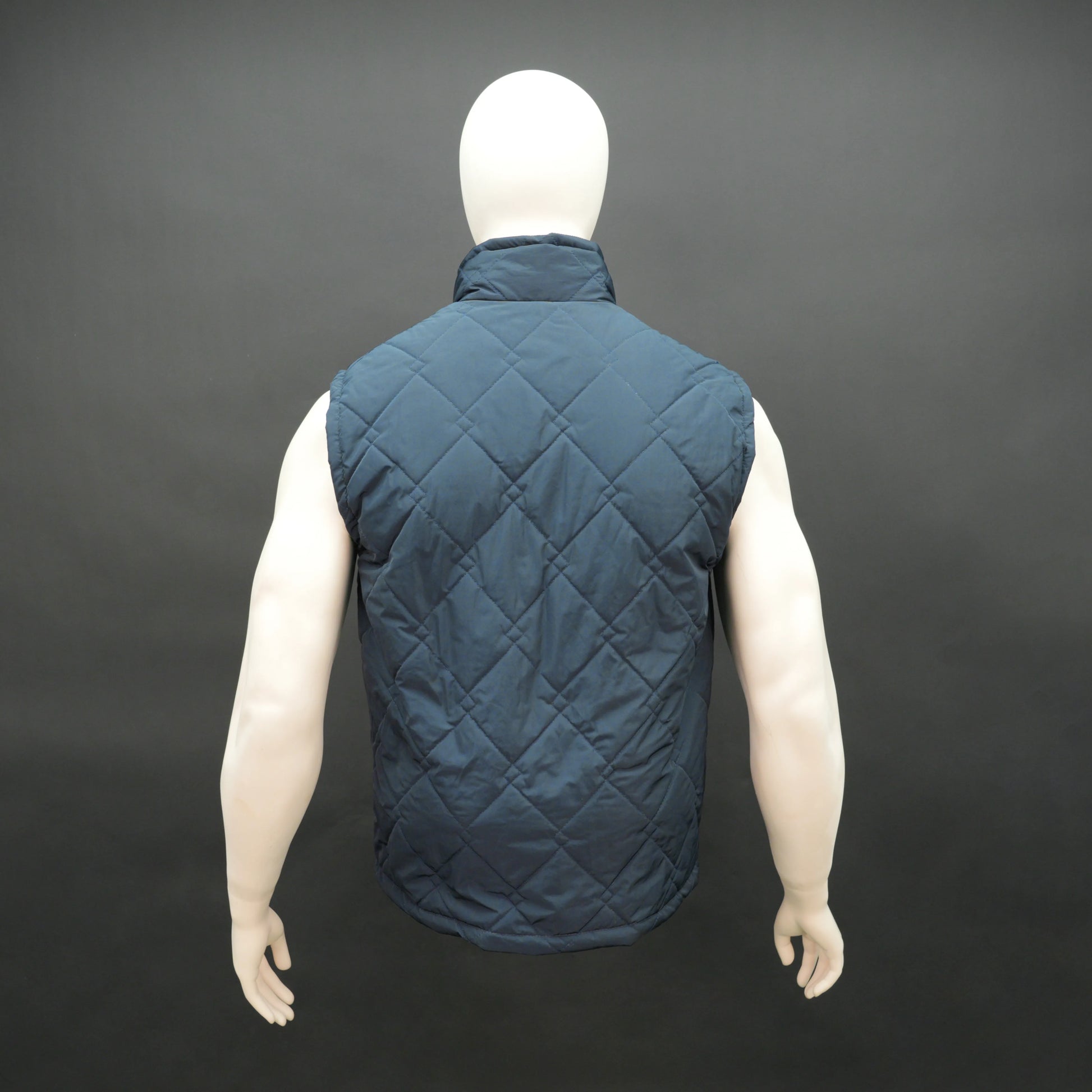 Men’s navy double diamond puffer vest sleeveless gilet with zip closure and pockets for layering.