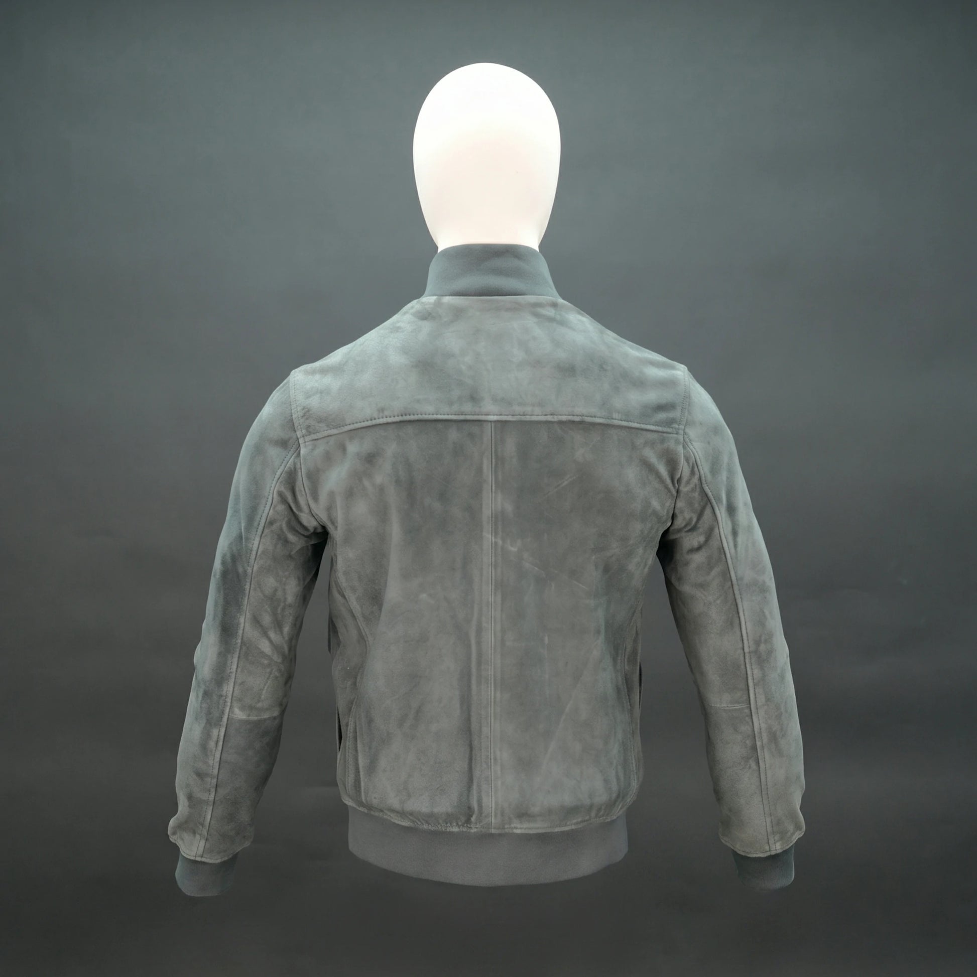 Suede jacket with mandarin collar, button closure, flap pockets, and slim fit.