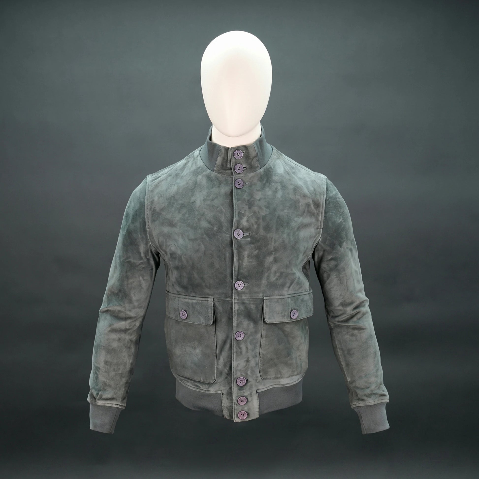 Suede jacket with mandarin collar, button closure, flap pockets, and slim fit.