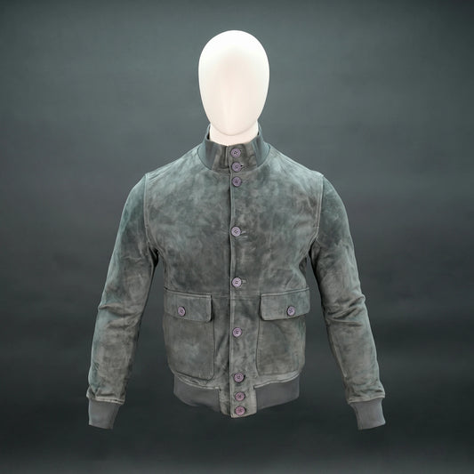 Suede jacket with mandarin collar, button closure, flap pockets, and slim fit.