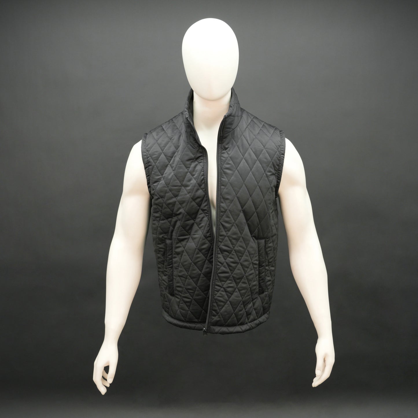 Black sleeveless quilted jacket with front zip, lightweight fabric, and multiple pockets