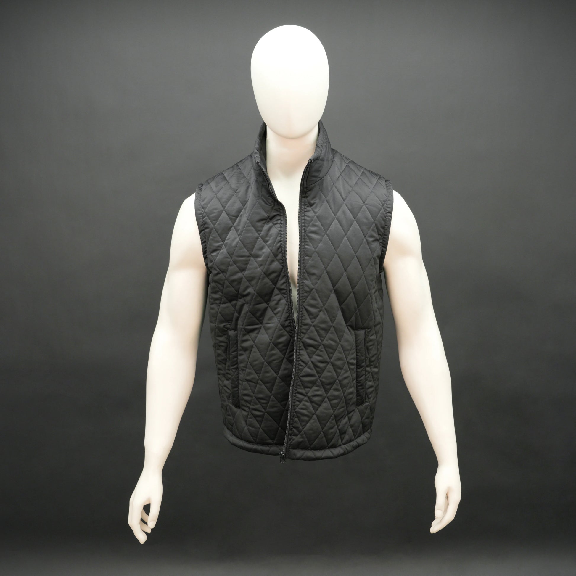 Black sleeveless quilted jacket with front zip, lightweight fabric, and multiple pockets